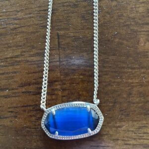 Kendra Scott necklace. Blue stone set on rose gold setting/necklace.